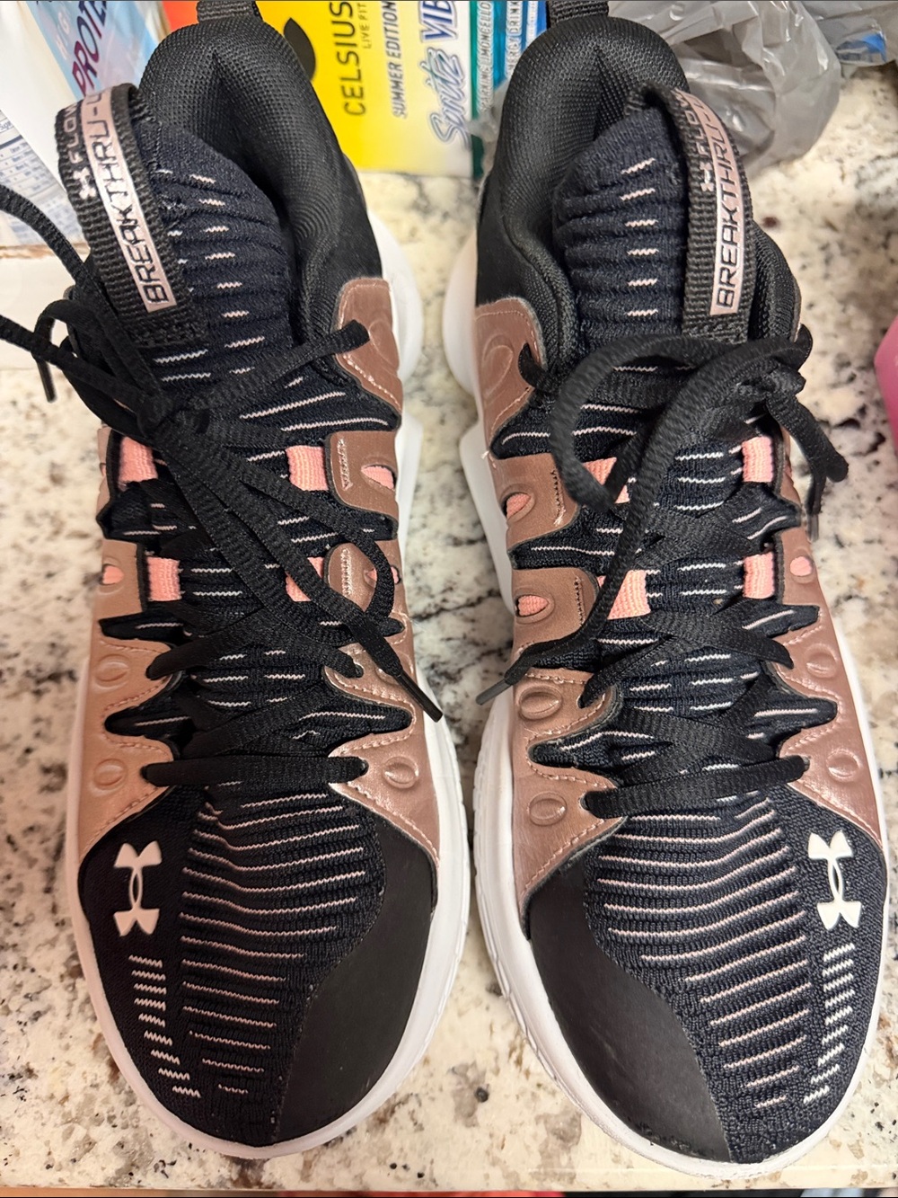 Under Armour Women’s Black and Rose Gold Breakthru basketball shoes